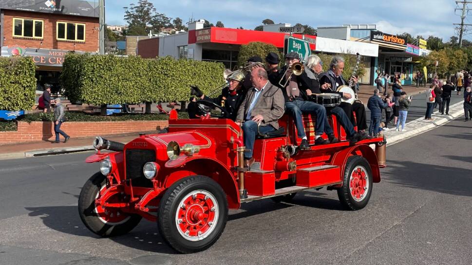 Mayor Russell Fitzpatrick in a previous Jazz Festival street parade on Merimbula Rural Fire Service's 1926 Garford.