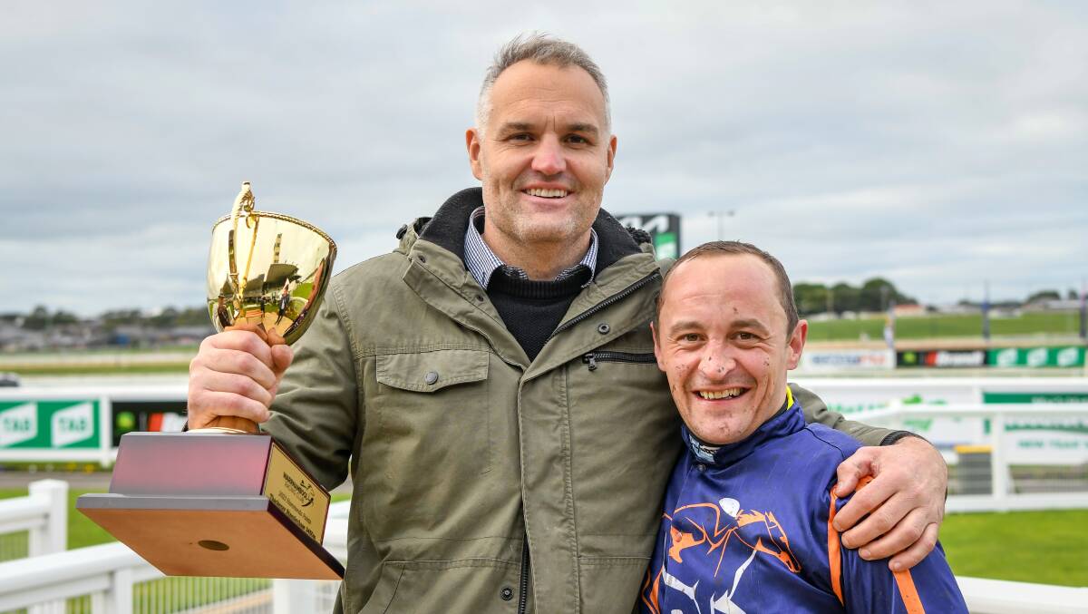 Andrew Bobbin with Tom Ryan after winning the Hammonds Paints Thackeray Steeplechase at Warrnambool Racecourse on July 02, 2023 in Warrnambool, Australia. (Photo by Alice Miles/Racing Photos)