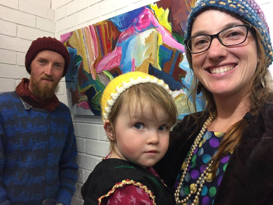 Bermagui artist John Barnard with his daughter, Frida, and Katie Annand after his artwork, Birthing, took second place in the 2018 River of Art prize.