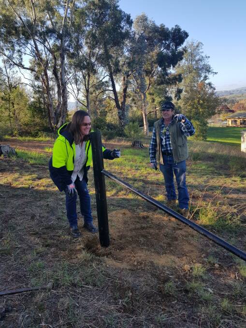 RECOVERY SKILLS: Students at a recent TAFE farm fencing course learn the finer points of rebuilding infrastructure damaged in the Black Summer bushfires.
