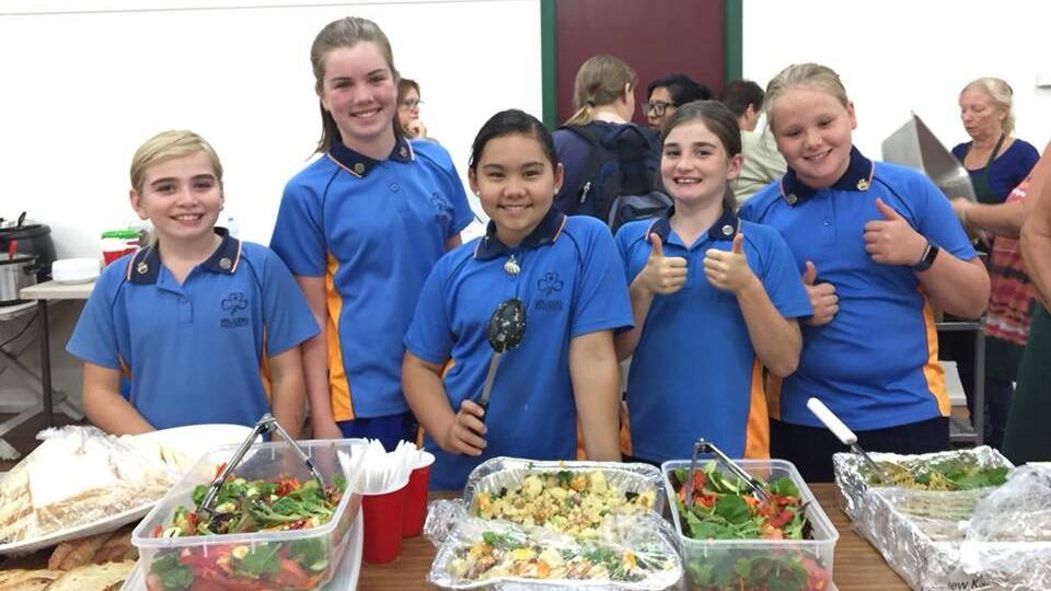 Among the many people who helped were Bega and Merimbula Guides who served meals at the evacuation centre. Their happy faces rubbed off on many others.