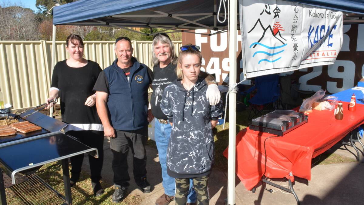 Manning the Candelo Kokoro Kai Goju Karate barbecue at Vinnies' ski gear sale and winter appeal are Kathleen Nugent, Mick Curtis, Rob Graham and Amelia Curtis.