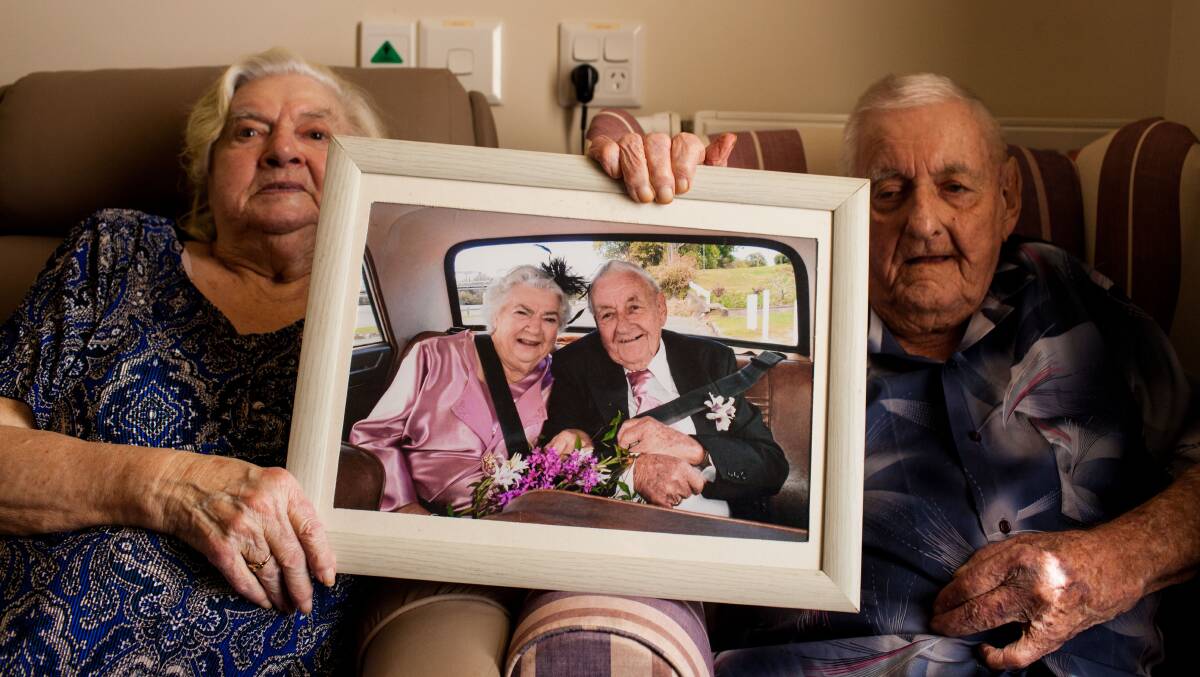 BE MY VALENTINE: Yvonne and Tom Baverstock-Ward hold up their wedding photo. Picture: Rachel Mounsey