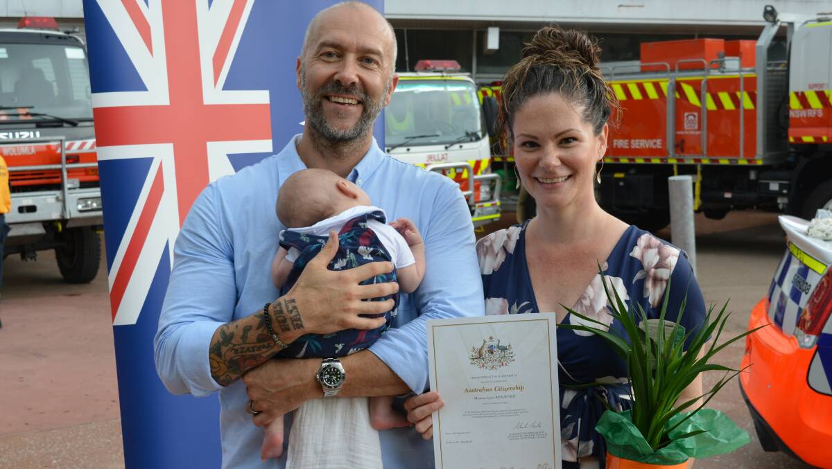 New Australian citizen Monica Bradford with husband David and son Archie. Photo: Ben Smyth