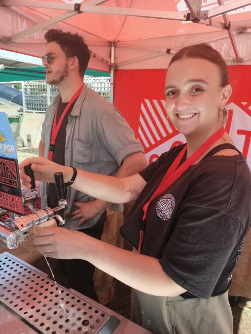 Alex and Hilary serve samples of Capital Brewing Company beers at the weekend's Craft Beer Festival at Club Sapphire Merimbula. photo: Ben Smyth