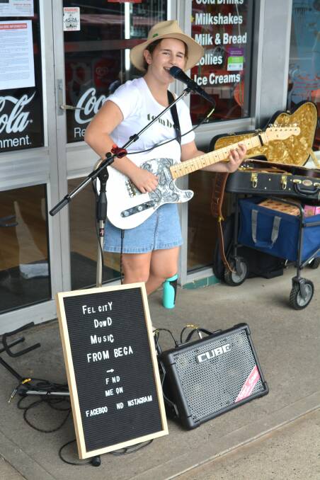 Bega musician Felicity Dowd helps "Share the Love" at Friday evening's street party in Pambula.