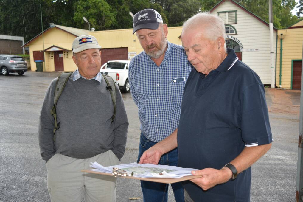 BIG PLANS: Phil Moffitt, Charlie Bell and John Hamilton look over concept plans for a redeveloped Bega Showground function centre. Photo: Ben Smyth