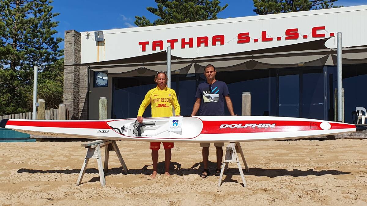 Tathra SLSC representative Troy Burhop and Dr Arvind Chawla with the new Dolphin surf ski.