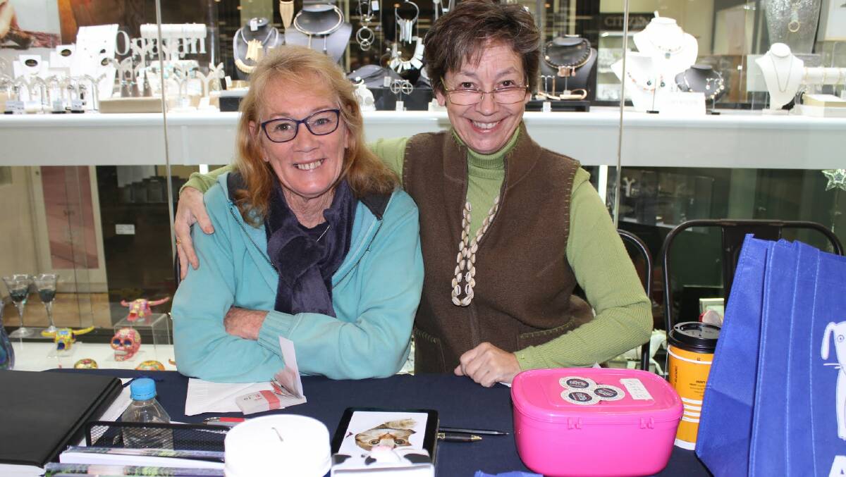Animal Welfare League FSC volunteers Helen Hall and Jeanette Sinclair sell raffle tickets in Bega on Thursday.