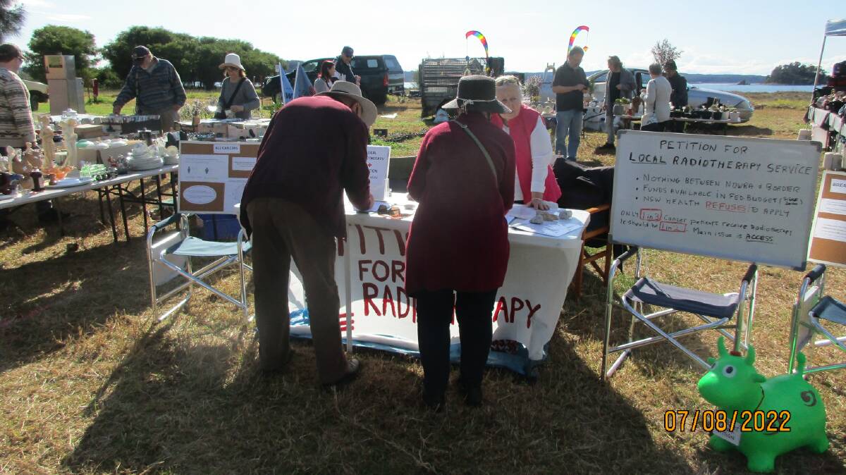 Advocates for local radiotherapy services collect petition signatures at the recent Batemans Bay markets.