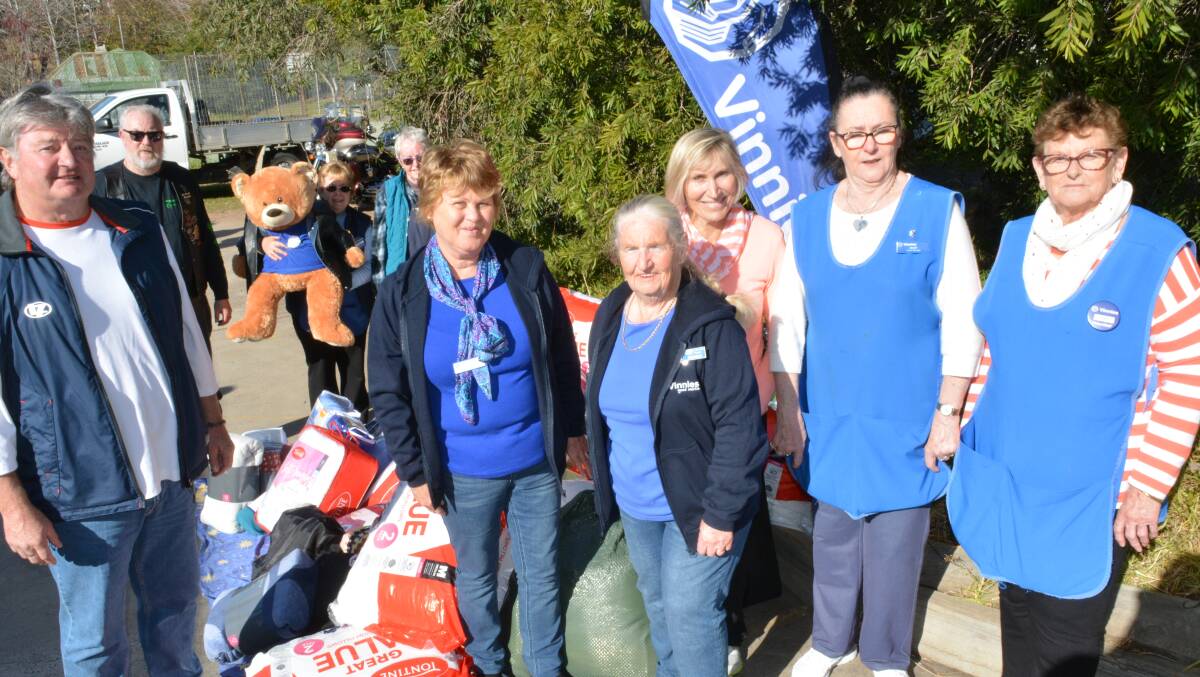 Volunteers at Bega Vinnies welcome the donations of warm blankets and clothing collected by motorcyclists on their annual winter ride.