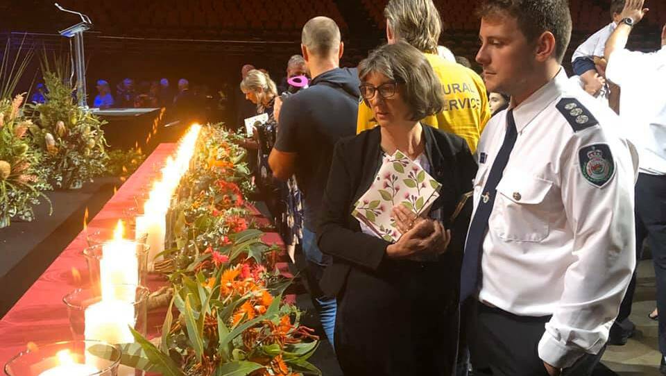 Rosey and Nathan Barnden pay tribute to bushfire victims at Sunday's state memorial service in Sydney. Photo: Clem Barnden