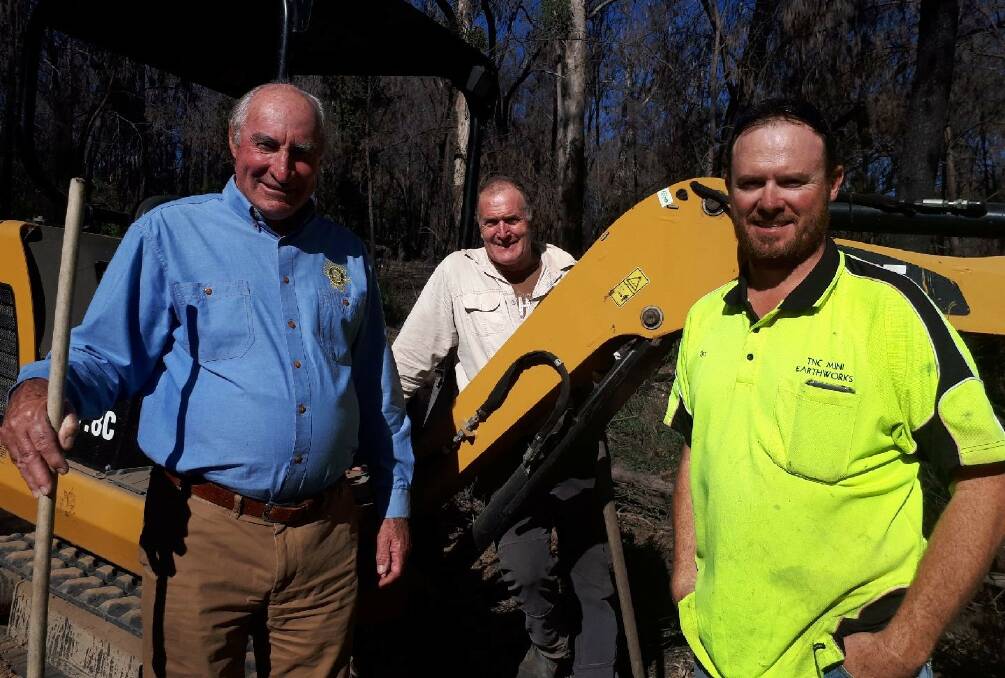DIGGING IN: Phil McDonald from Rotary with Andrew Johnson of the Tathra MTB Club and Tim Carrroll from T&C Earthworks. Photo: Supplied