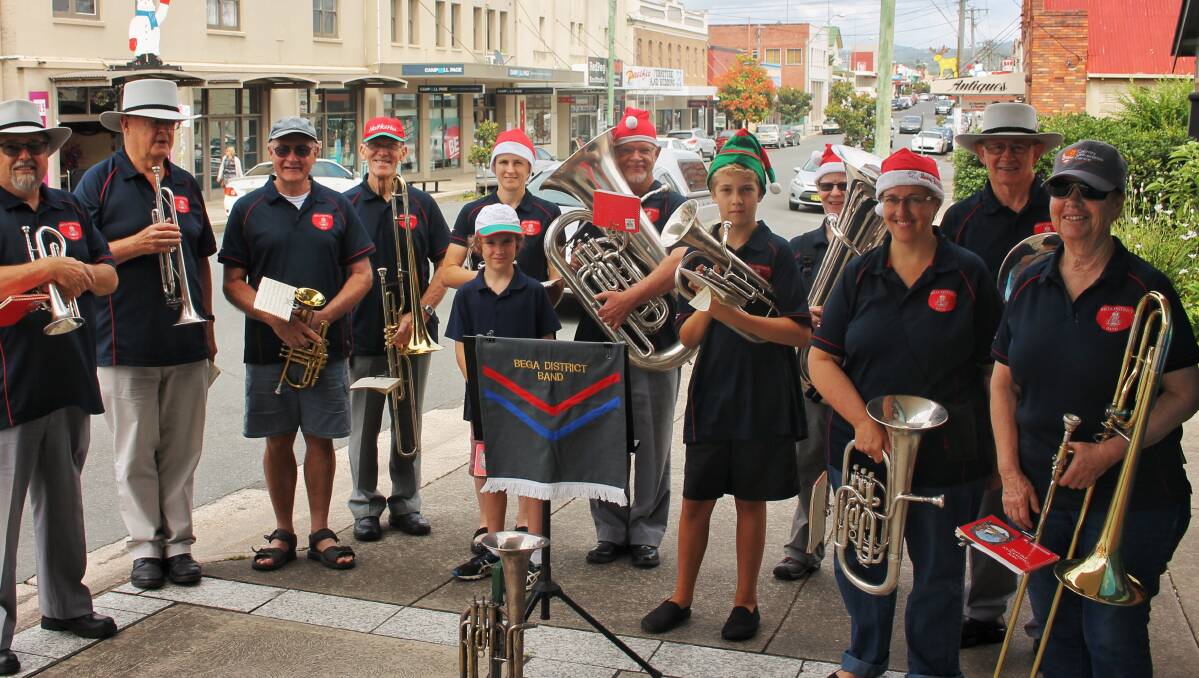SOUNDS OF THE SEASON: Bega District Band members take Christmas to the streets in 2017. On Sunday they are part of Bega's Carols by Candlelight event.