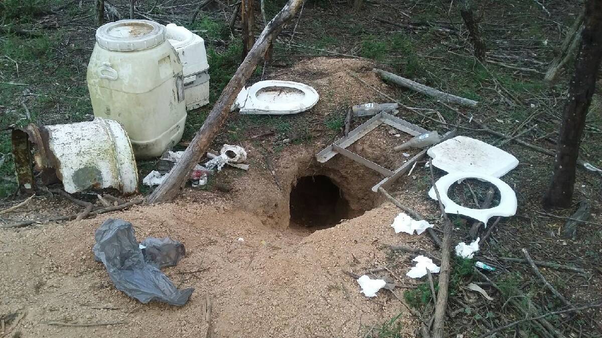 FOUL: Campers at Brogo Dam look to have used a wombat burrow as their toilet, leaving their excrement and other waste behind.