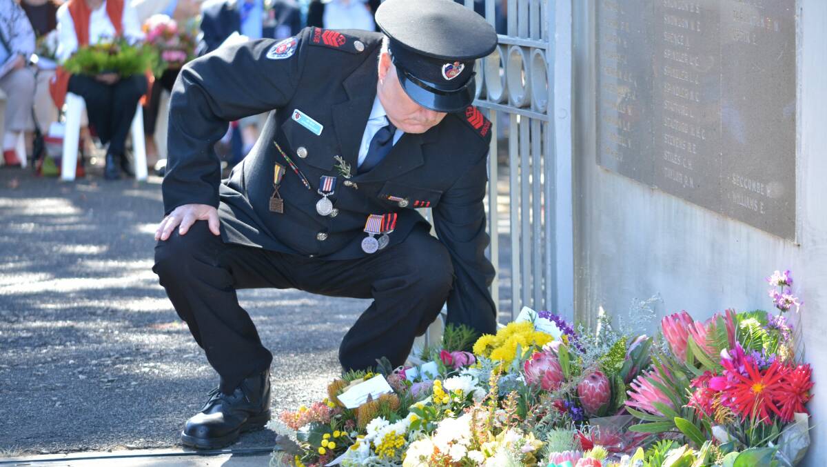 Jim Kelly representing Bega Fire and Rescue lays a wreath on Anzac Day