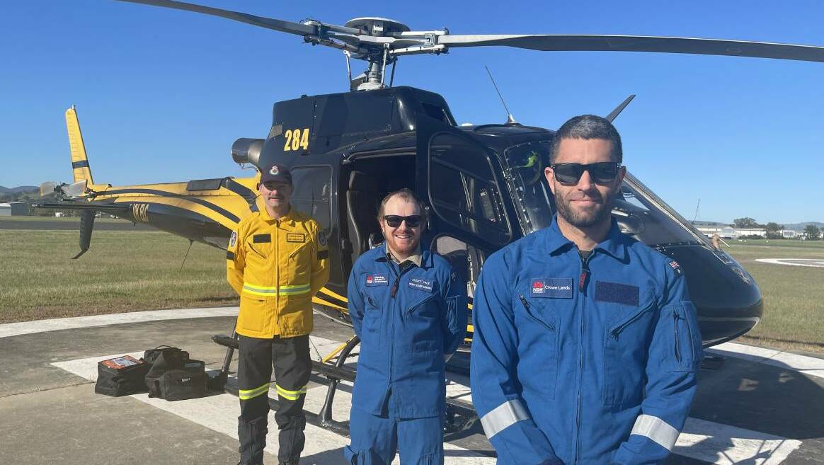 RFS officer Andrew Davis, Crown Lands officers Scott Vale, and mission commander Shaun Flood at Albury Airport. Photo: Supplied