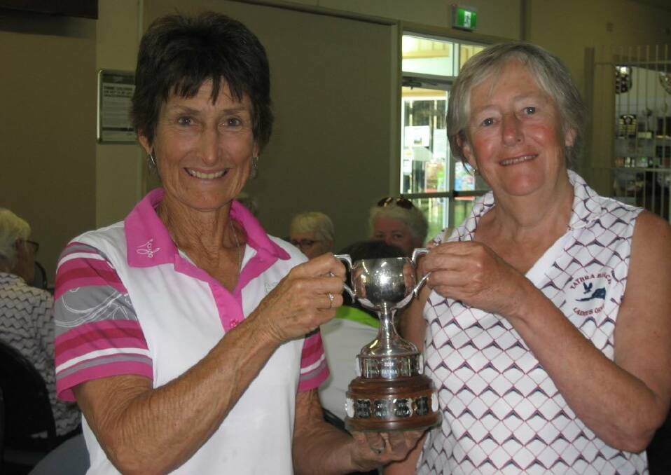 RETURN MATCH: Bega Golf Club's Wendy Hergenhan receives the Jellat Cup from Tathra’s Wendy Rhodes.