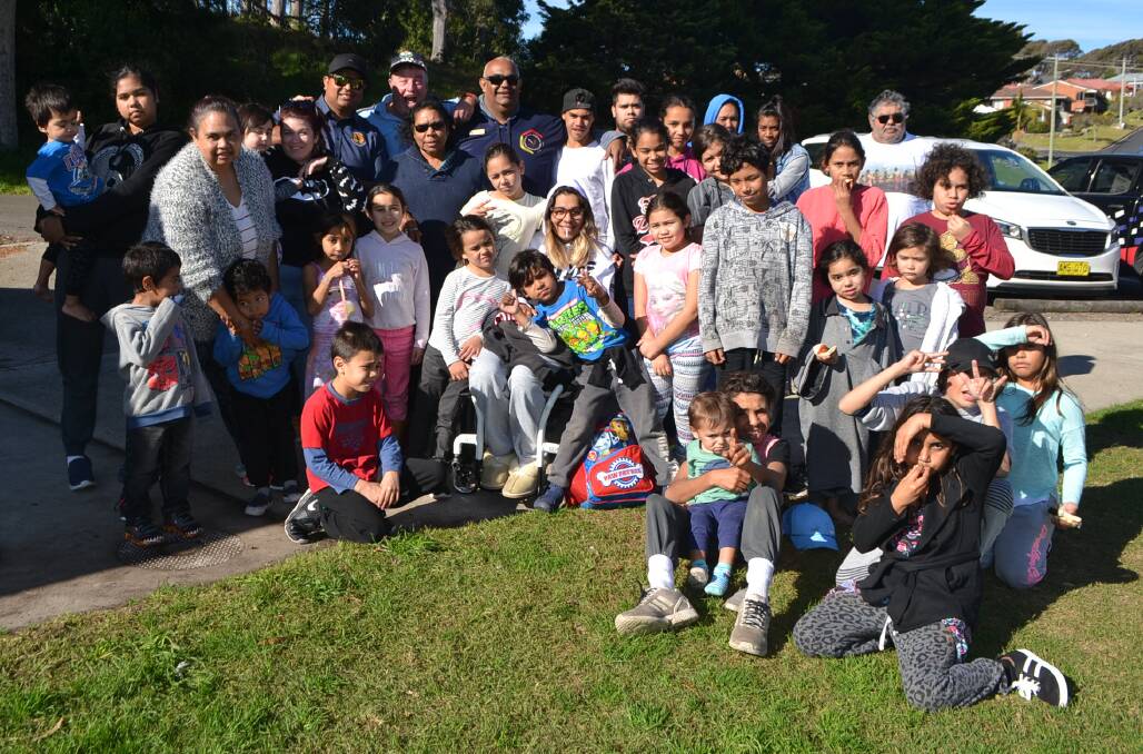 HOLIDAY PROGRAM: Children and elders involved in the Wallaga Lake holiday program enjoy a trip to Rotary Park at Narooma after the movies. 