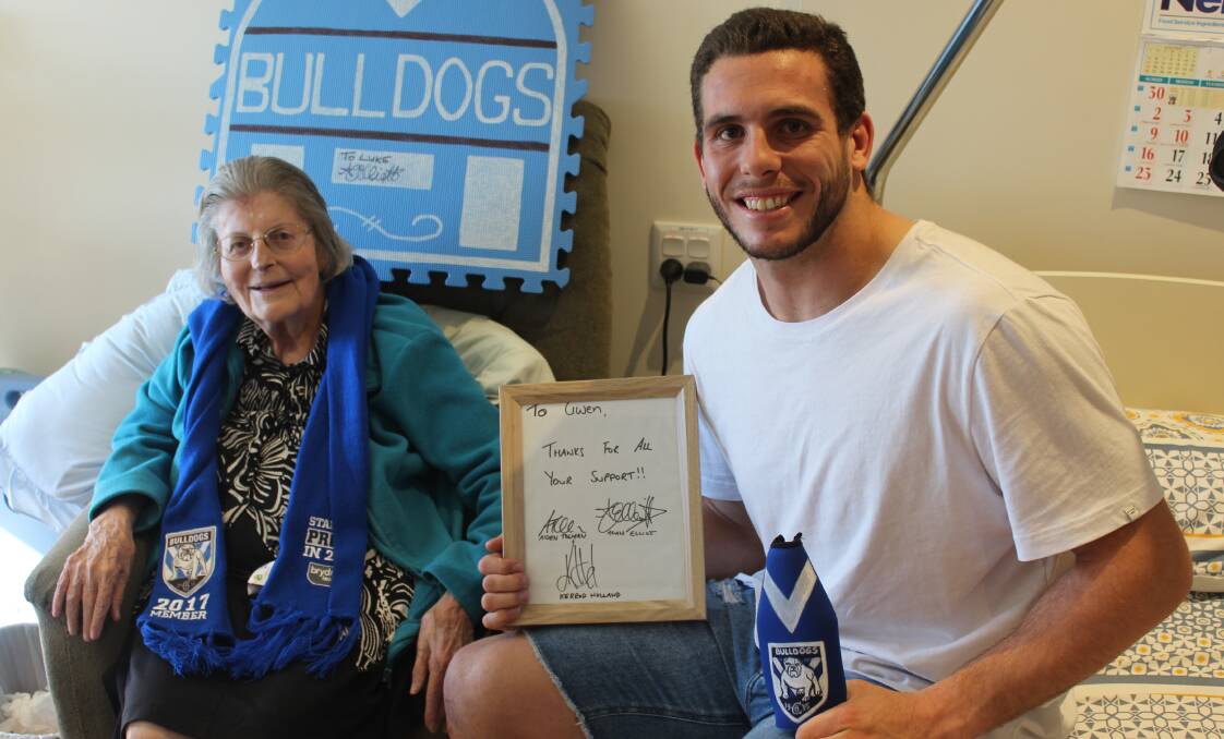 FAN VISIT: NRL player Adam Elliott chats with Hillgrove House Nursing Home resident - and keen Bulldogs fan - Gwen Tapper during a visit home this week. Photo: Ben Smyth