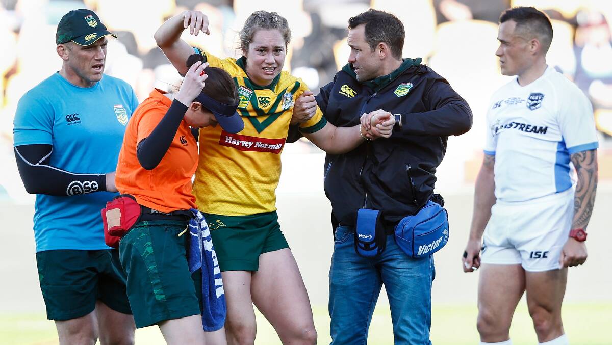 Kezie Apps leaves the field injured during the Trans-Tasman Test between the Australian Jillaroos and the Kiwi Ferns. Picture: AAP