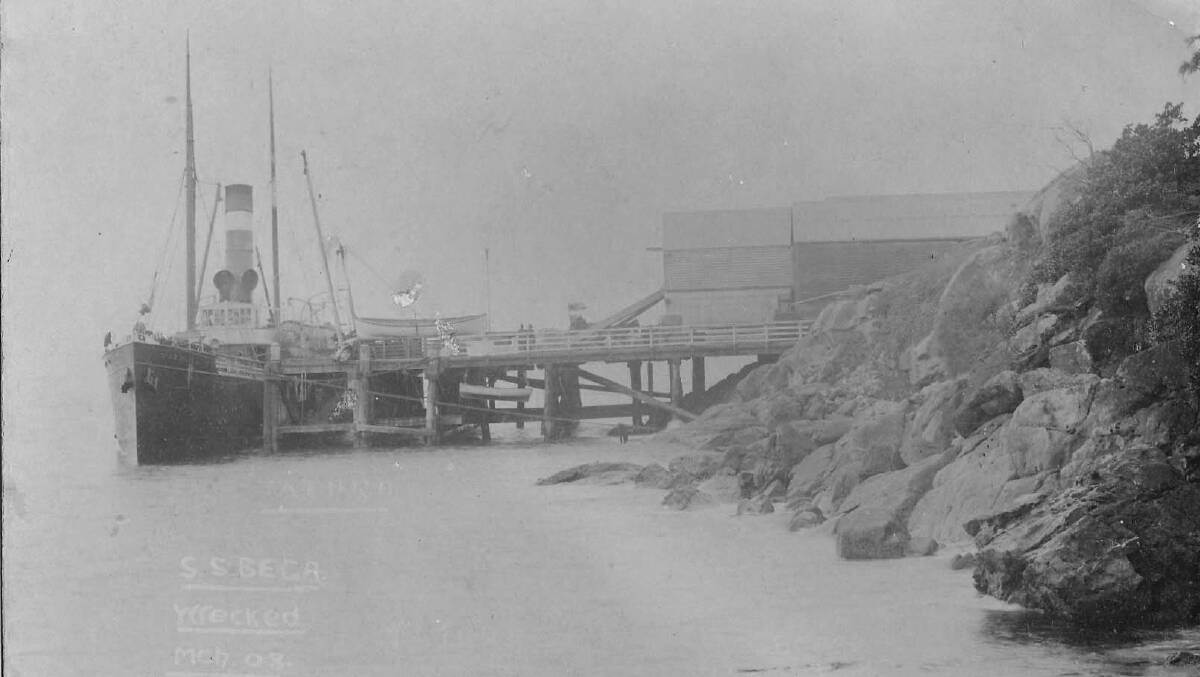 SS Bega takes on cargo at Tathra Wharf. Picture courtesy of the Bega Pioneers Museum.