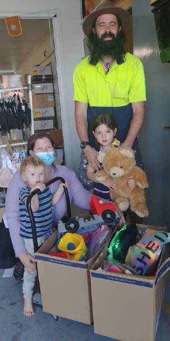 Joe and Viv, and children Jasper and Ava, donate toys to those less fortunate via the Sapphire Community Pantry. Photo: Supplied