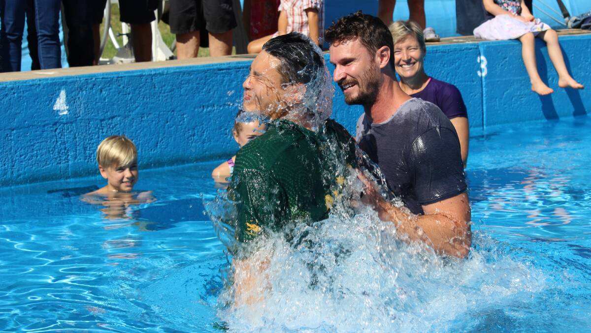 Chris Cheung is baptised by Grace Church pastor Dan Riethmuller in a special service at the Bega Pool. Picture: Alison Moffitt