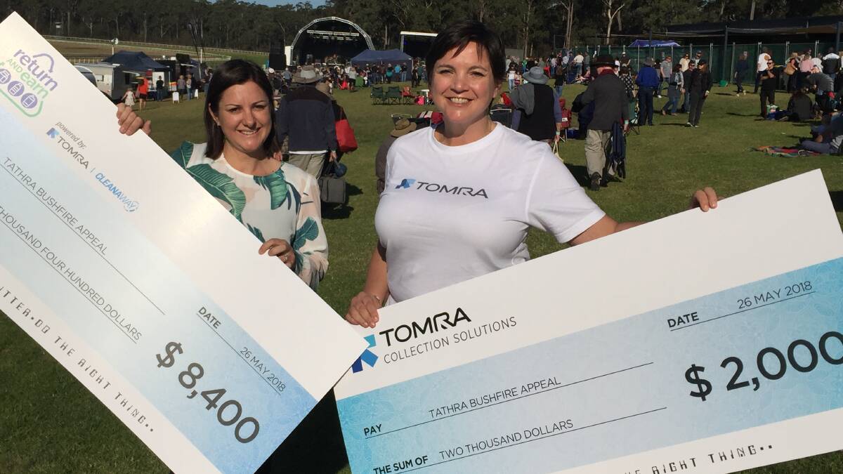 Bega Valley Shire Mayor Kristy McBain accepts a donation from Tomra representative Claire Mawdsley, the proceeds from April's inclusion of the bushfire appeal fund on the state's Return and Earn recycling machines.