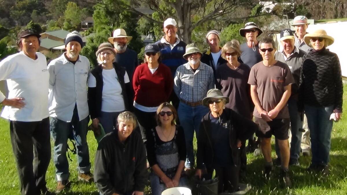 Members of Tathra LandCare after a recent working bee planting rainforest trees.