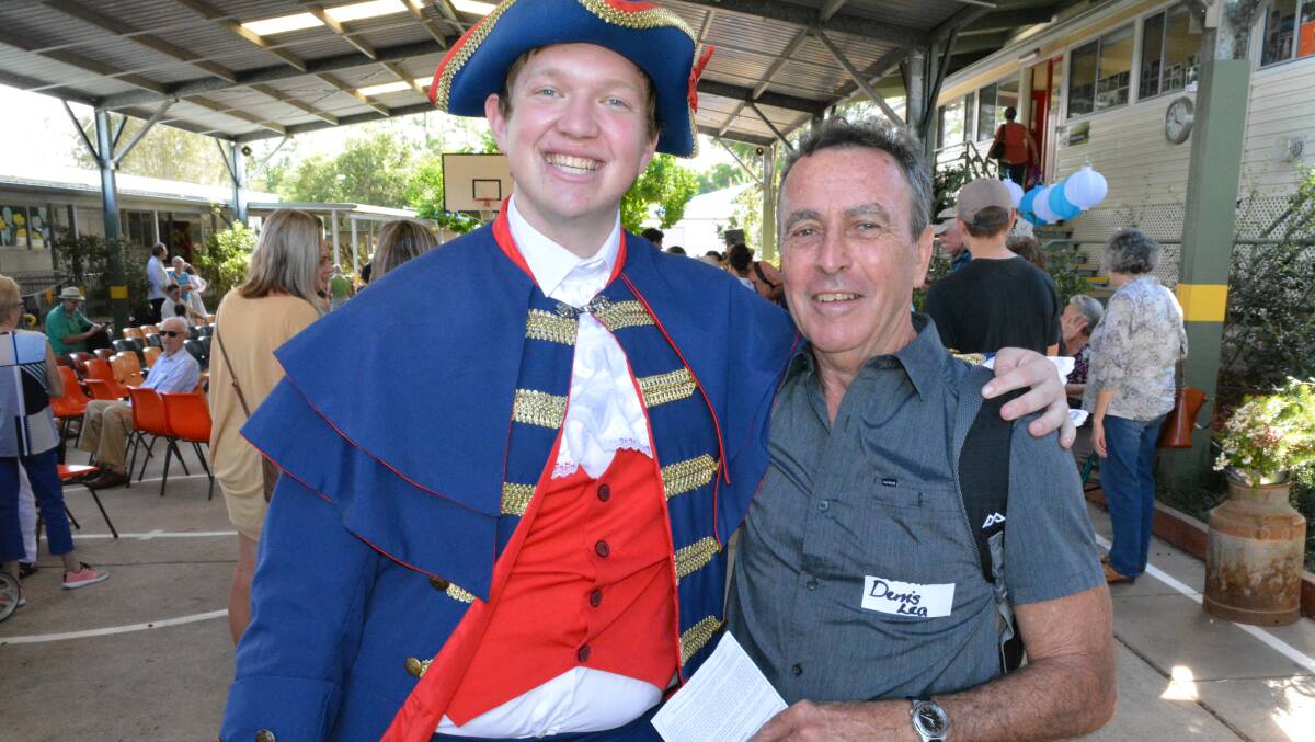 "Town crier" Matthew Gibbs catches up with one of his former teachers Denis Lea at the Candelo Public School 150th birthday.