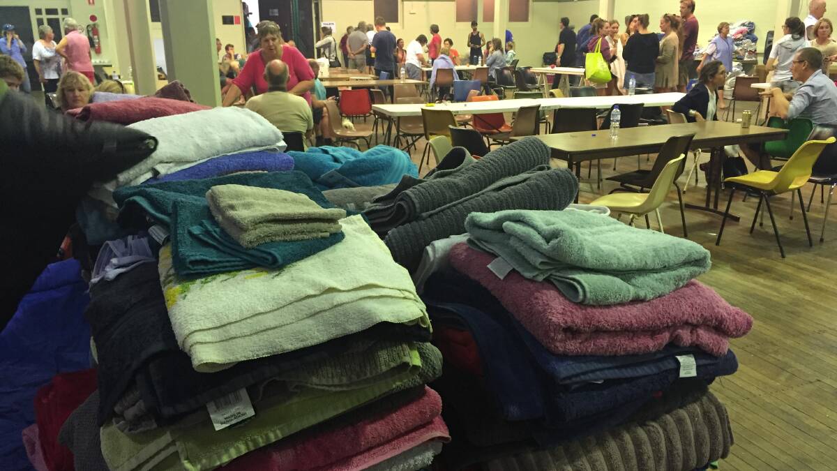 Donations of towels and blankets pour in to the Bega Evac Centre following the fire at Tathra