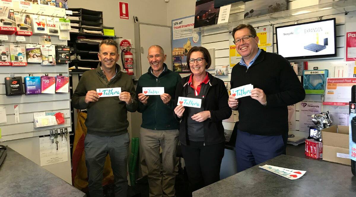 CONNECTING PEOPLE: Andrew Constance, Euan Ferguson and Troy Grant drop in to say thanks to Deb Alker at the Tathra Post Office.