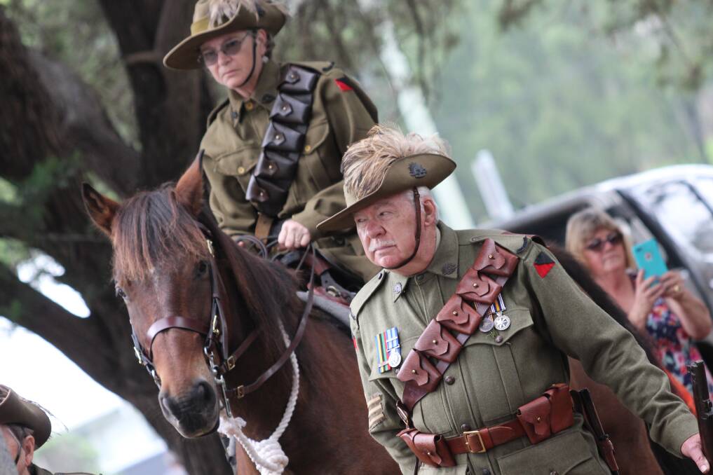 HONOUR: Members of the 7th Light Horse Bemboka Troop take part in Cobargo's Anzac Day service. Photo: Albert McKnight. More photos, videos online