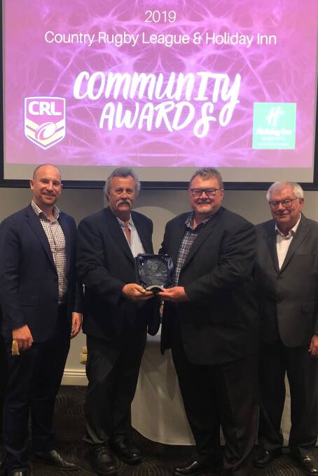 WINNERS: Tathra Sea Eagles Rugby League Football Club president Peter Finucane and secretary David Porter accept the CRL Club of the Year award on Saturday night.