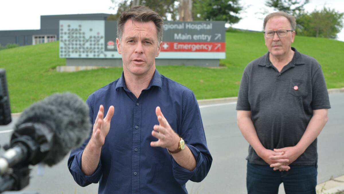 NSW Labor leader Chris Minns and Labor candidate for the seat of Bega Michael Holland speak to journalists outside the South East Regional Hospital on Sunday, January 16. Photo: Ben Smyth