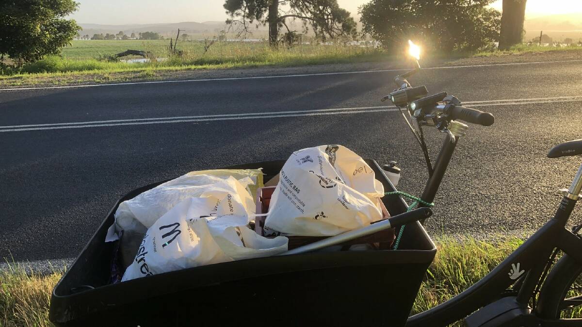 Doug Reckord is a familiar sight on his trike collecting rubbish from the roadside of Bega-Tathra Road and Sapphire Coast Drive. Photo supplied