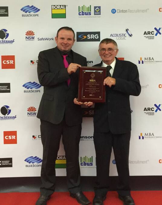 ON TARGET: Damien and George Hoyland of Bega-based Hoyland Constructions celebrate their MBA Excellence in Construction Award. Picture: Supplied