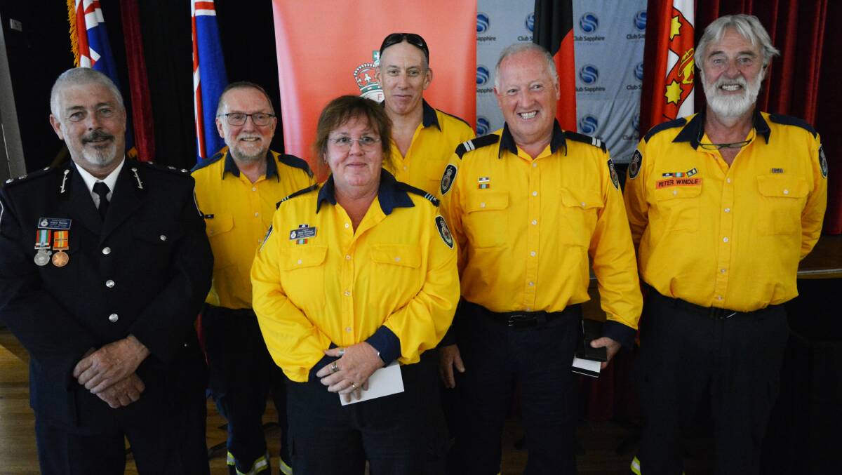 Members of the Tathra Rural Fire Brigade receive their National Emergency Medals. Photo: Ben Smyth