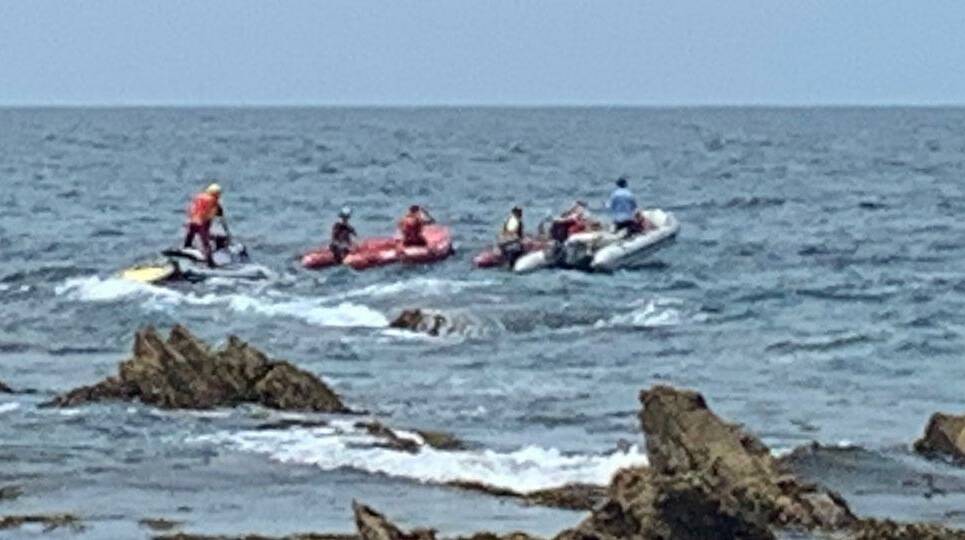 Search and rescue personnel on jetskis and IRBs near Barragga Bay on Friday. Photo: Surf Life Saving Far South Coast
