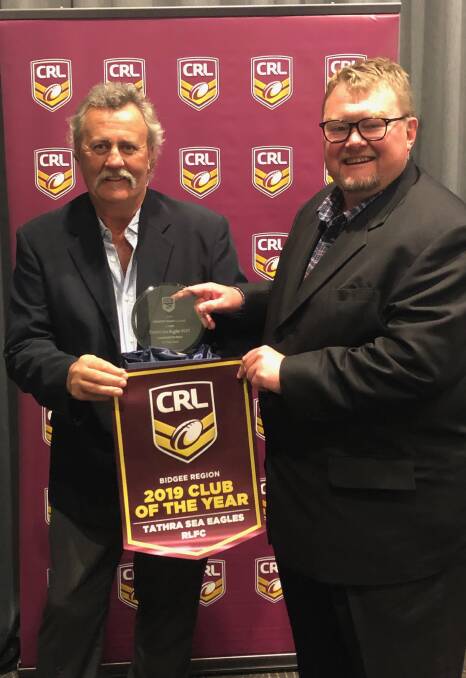 WINNERS: Tathra Sea Eagles Rugby League Football Club president Peter Finucane and secretary David Porter accept the CRL Club of the Year award last month.