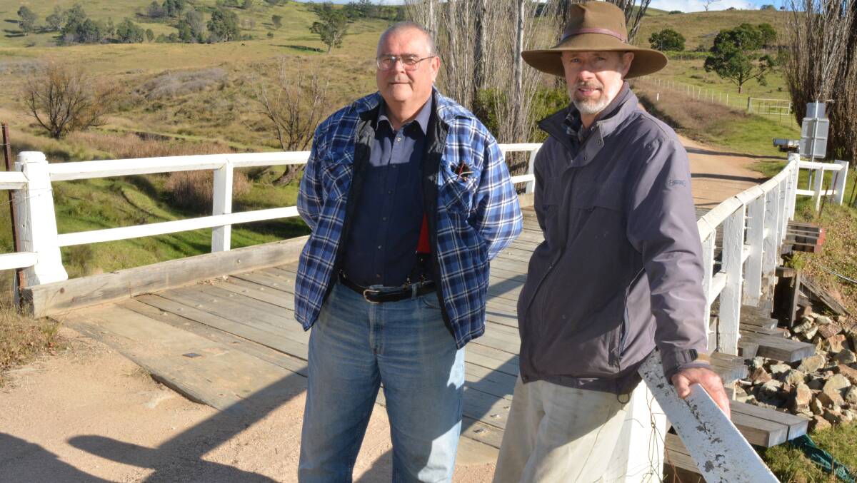 THREATENED: Property owners Phil Chadwick and Barry Hergenhan have concerns over council's plans for two bridges on Garfields Rd, Numbugga. Photo: Ben Smyth