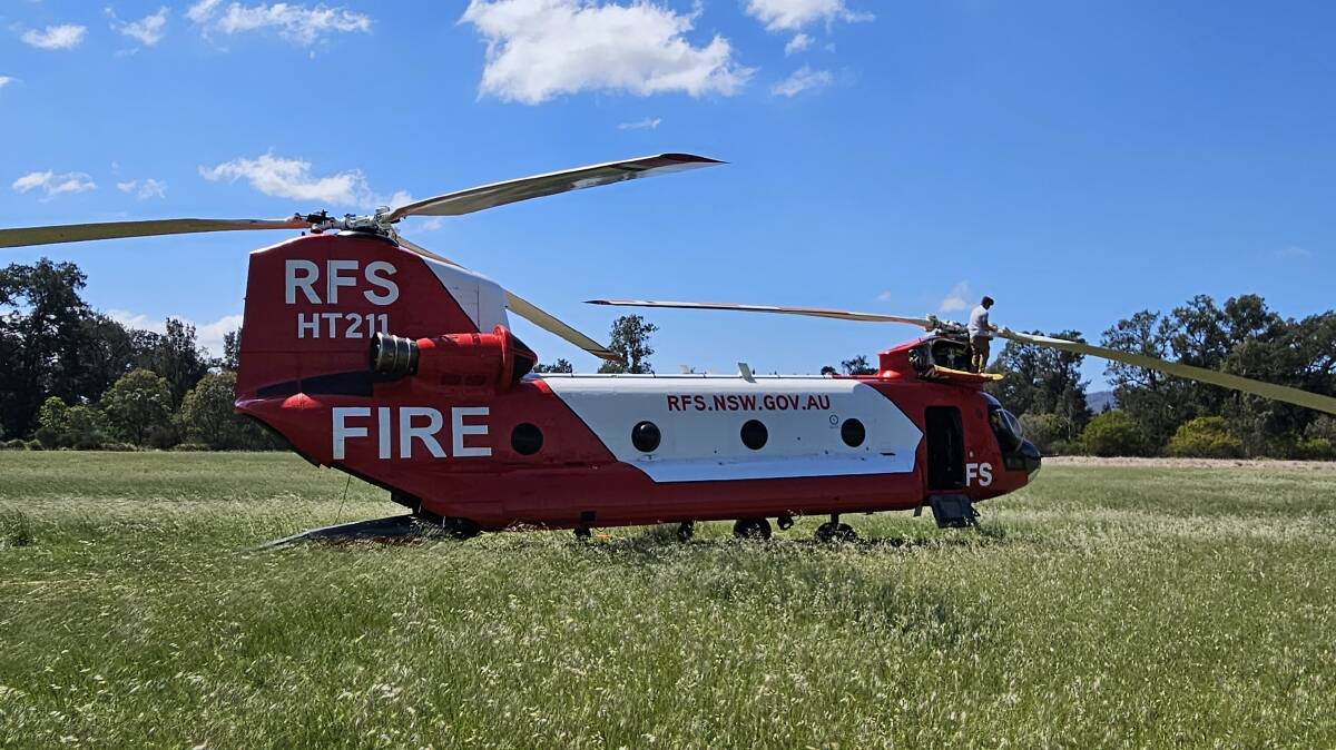 The RFS Chinook supporting firefighting activities can carry 10,000 litres of water. Picture by RFS Far South Coast