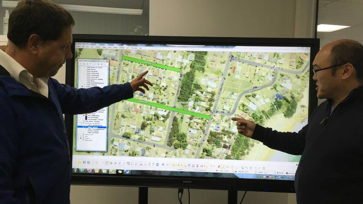 Council’s asset systems analyst Steve Katona and asset management coordinator Gary Louie use the interactive NOC.