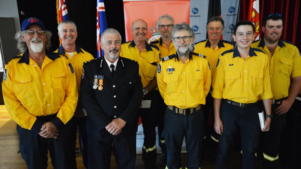 Members of the Candelo Rural Fire Brigade receive their National Emergency Medals. Photo: Ben Smyth
