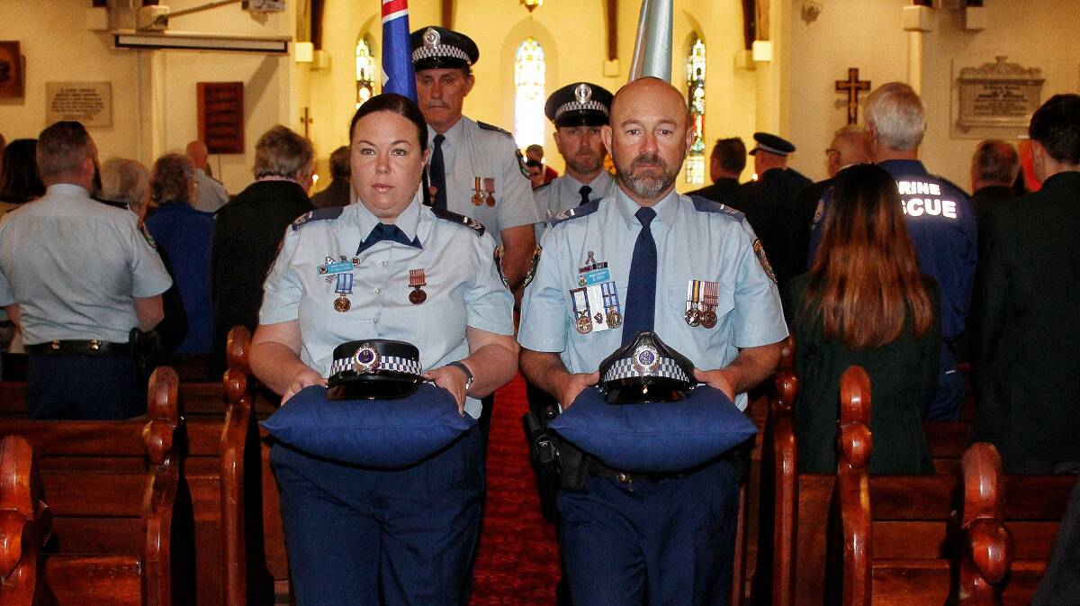 REMEMBRANCE: NSW Police officers Senior Constables Karen Nelligen and Brad Ross, supported by Andrew Burden and Marc Royle, at the 2018 Police Remembrance Day service. Picture: Alasdair McDonald