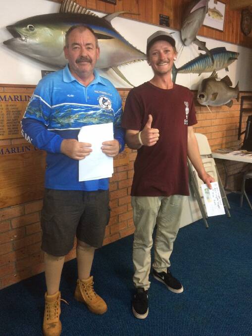 Ben Thelan of Tathra, winner of the Merimbula Snapper Classic, receives the $600 cash prize for his magnificent 73.8cm snapper from club vice-president Alan Wilkins.