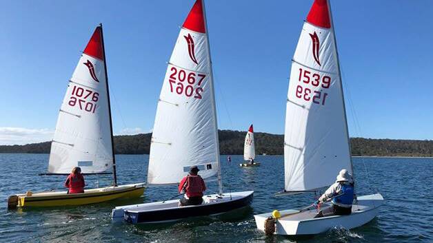 Setting sail on new season: Sabre dinghies made up four of the seven boats racing on Wallagoot Lake on Saturday.