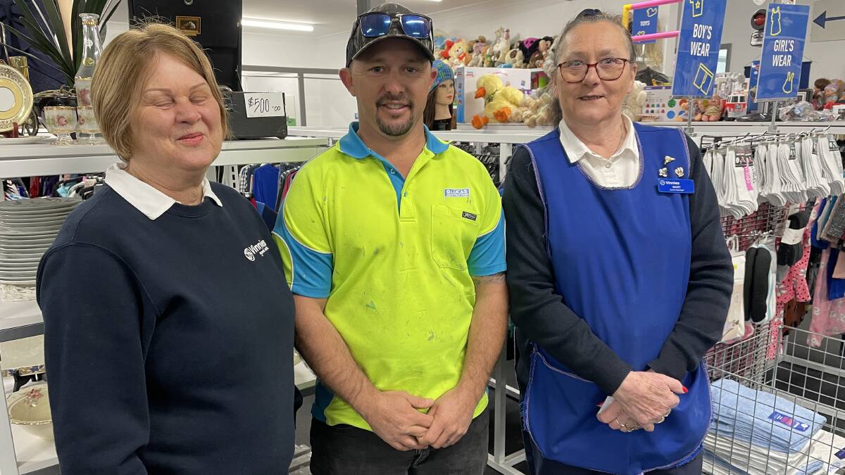 Glynn Lucas, of G Lucas Constructions, is thanked by Bega Vinnies volunteer Danni Koenigkamp and store manager Mary Nugent for funding the store's new defibrillator. Photo: Ben Smyth