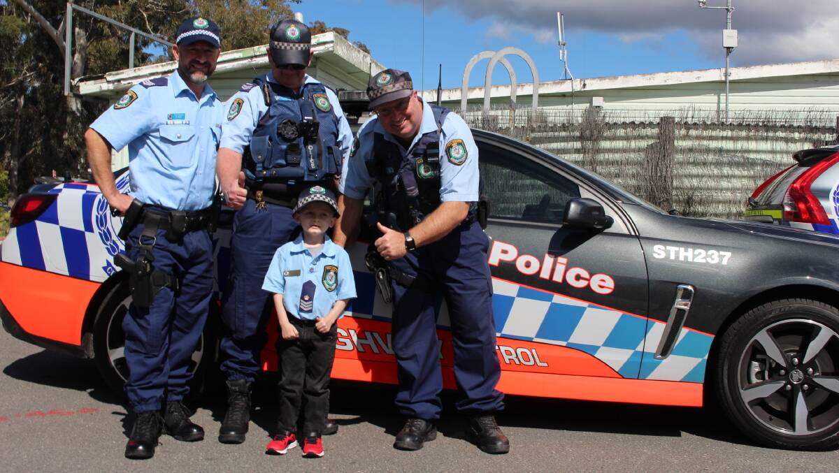 Officers from the Far South Coast Highway Patrol make another of Joshie Oakhill's bucket list items come true by showing him how they catch a speeding driver.